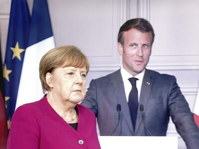 Video-Schalte: Bundeskanzlerin Angela Merkel (CDU) und Frankreichs Präsident Emmanuel Macron. Quelle: dpa